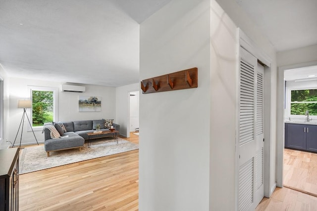 41 Harvey Ln, Westborough, MA 01581 - hall featuring a wall mounted AC, light wood finished floors, and healthy amount of natural light