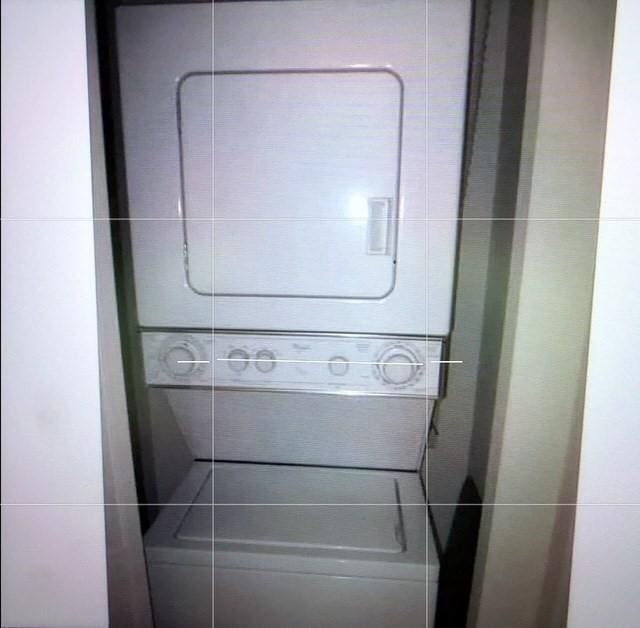 121 Tall Oaks Dr Unit F, Weymouth, MA 02190 - washroom featuring stacked washing machine and dryer