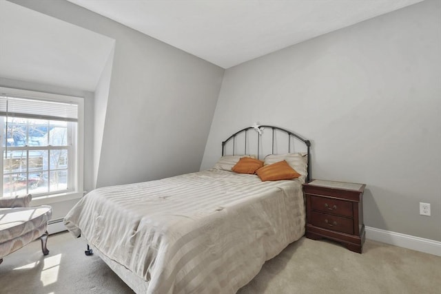 bedroom featuring light carpet, a baseboard radiator, and baseboards