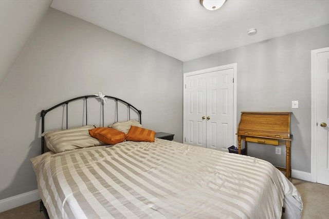 bedroom with carpet floors, a closet, and baseboards