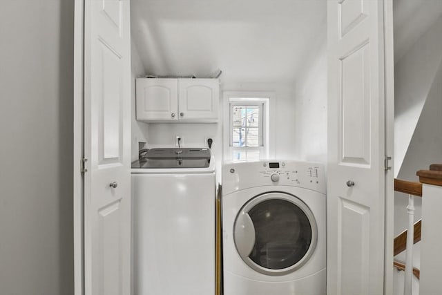 laundry room with washer and dryer and cabinet space