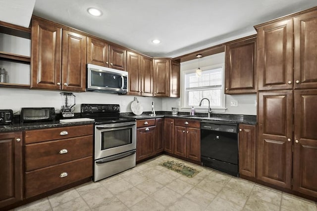 kitchen featuring open shelves, recessed lighting, appliances with stainless steel finishes, a sink, and dark stone counters