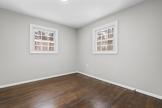 empty room featuring dark hardwood / wood-style floors