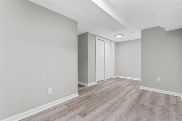 basement featuring light hardwood / wood-style flooring