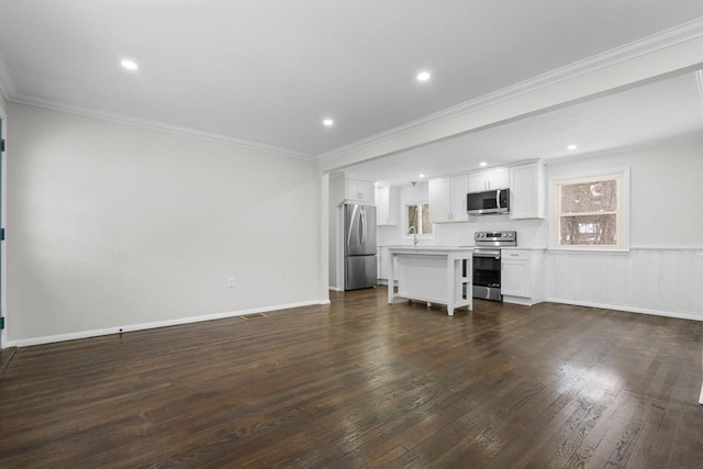 unfurnished living room with crown molding, dark hardwood / wood-style flooring, and sink