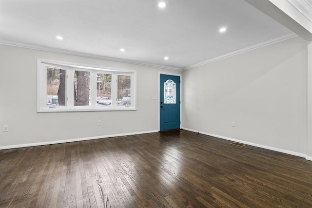 foyer entrance featuring crown molding and dark wood-type flooring