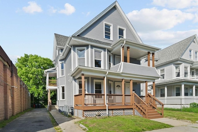 12-14 Kendall St, Springfield, MA 01104 - view of front of property featuring covered porch, a balcony, and driveway