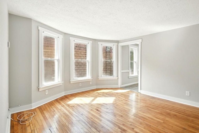 12-14 Kendall St, Springfield, MA 01104 - spare room featuring a textured ceiling, wood-type flooring, and baseboards