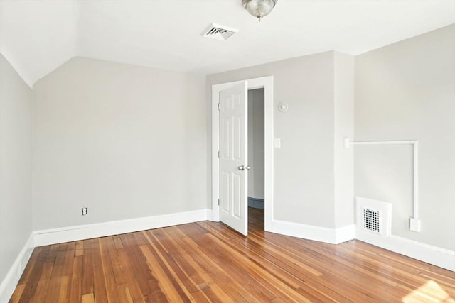 12-14 Kendall St, Springfield, MA 01104 - spare room featuring baseboards, hardwood / wood-style floors, and vaulted ceiling