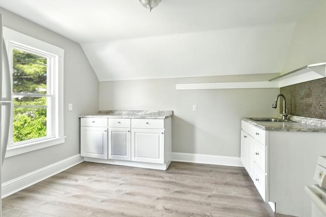12-14 Kendall St, Springfield, MA 01104 - laundry area with a sink, healthy amount of natural light, light wood-style flooring, and baseboards