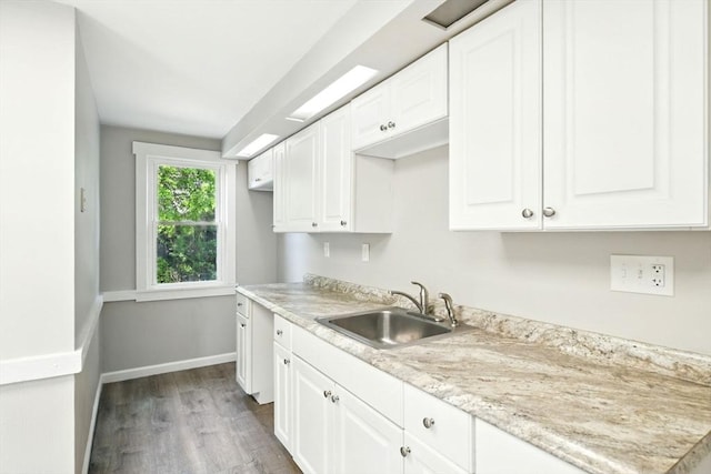 12-14 Kendall St, Springfield, MA 01104 - kitchen featuring a sink, dark wood finished floors, light countertops, white cabinets, and baseboards