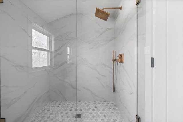 full bath with a marble finish shower