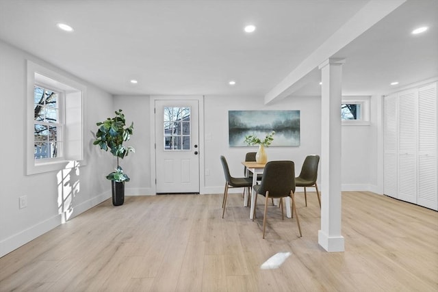 dining area with recessed lighting and light wood-style flooring