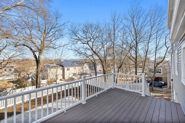 wooden deck with a residential view