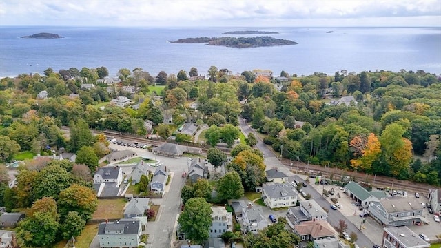 birds eye view of property with a water view and a residential view