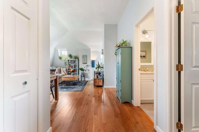 hall with light wood-type flooring