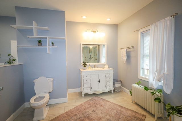 bathroom with vanity, toilet, radiator heating unit, and tile patterned floors