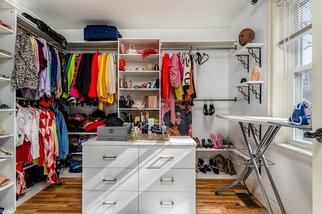 spacious closet with visible vents and wood finished floors