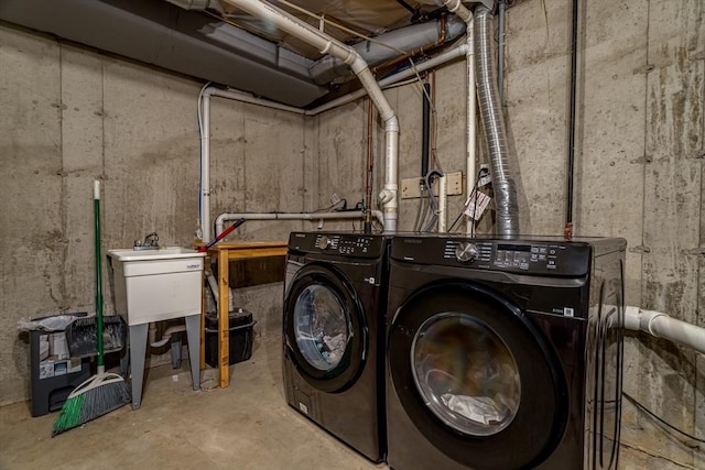 washroom featuring laundry area and washer and clothes dryer