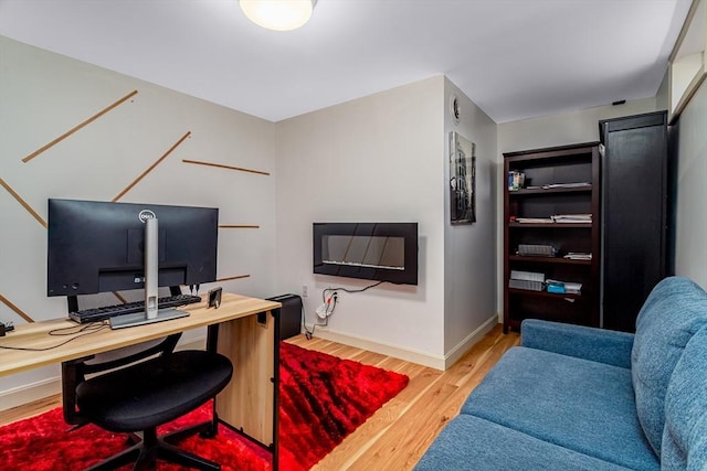 office area with wood finished floors and baseboards