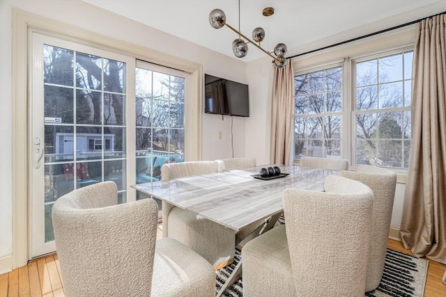 dining space with light wood-style floors