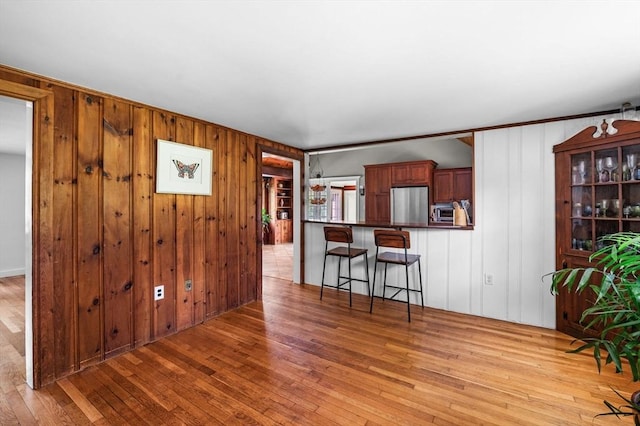 13 Clarks Rd, Amesbury, MA 01913 - living room featuring light wood-style floors and wooden walls
