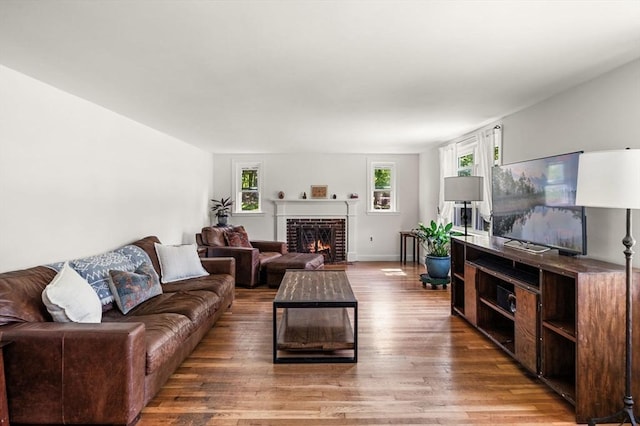 13 Clarks Rd, Amesbury, MA 01913 - living area featuring wood finished floors and a brick fireplace