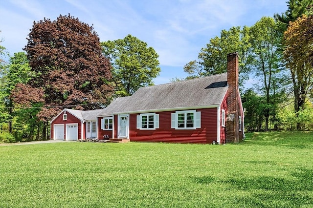 13 Clarks Rd, Amesbury, MA 01913 - view of front of home with a garage, a front lawn, a chimney, and driveway
