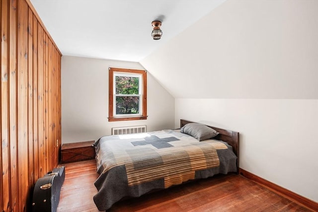 13 Clarks Rd, Amesbury, MA 01913 - bedroom featuring radiator, wood-type flooring, vaulted ceiling, and baseboards