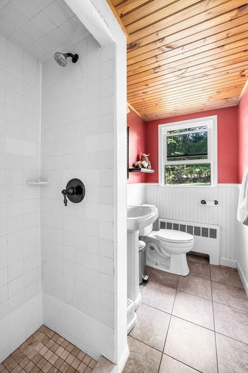 13 Clarks Rd, Amesbury, MA 01913 - full bath featuring radiator heating unit, wood ceiling, tiled shower, wainscoting, and tile patterned floors
