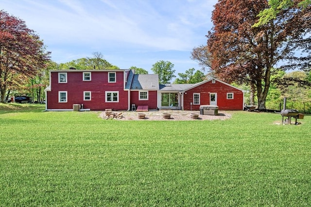 13 Clarks Rd, Amesbury, MA 01913 - rear view of property with a lawn and central AC