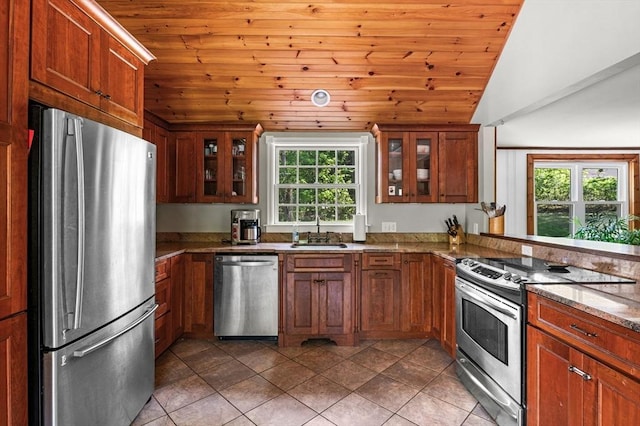 13 Clarks Rd, Amesbury, MA 01913 - kitchen featuring stainless steel appliances, lofted ceiling, wood ceiling, a sink, and brown cabinetry