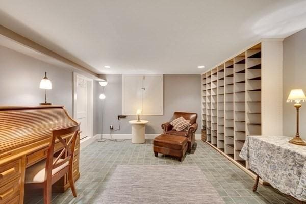 living area featuring baseboards