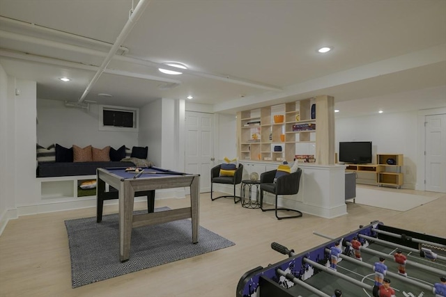 rec room with built in features, light hardwood / wood-style flooring, and billiards