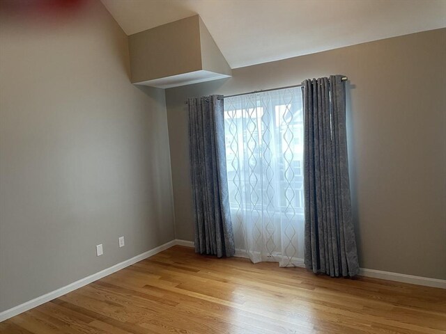 unfurnished bedroom with light hardwood / wood-style flooring and a closet