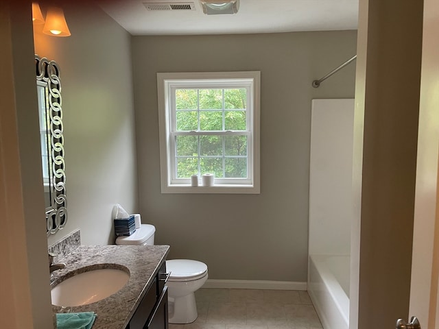 full bathroom with bathing tub / shower combination, tile patterned flooring, vanity, and toilet