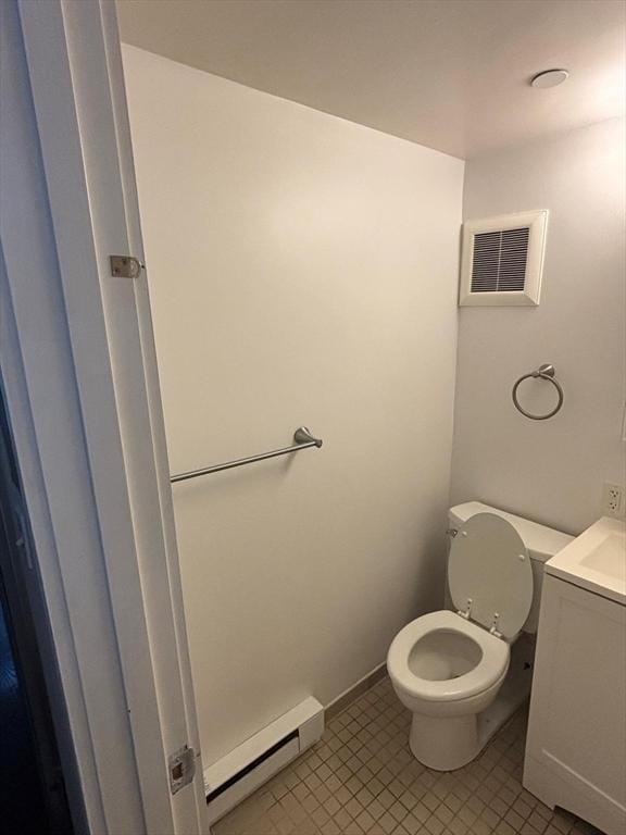 12 Stoneholm St Unit 313, Boston, MA 02115 - bathroom with a baseboard heating unit, vanity, toilet, and tile patterned flooring