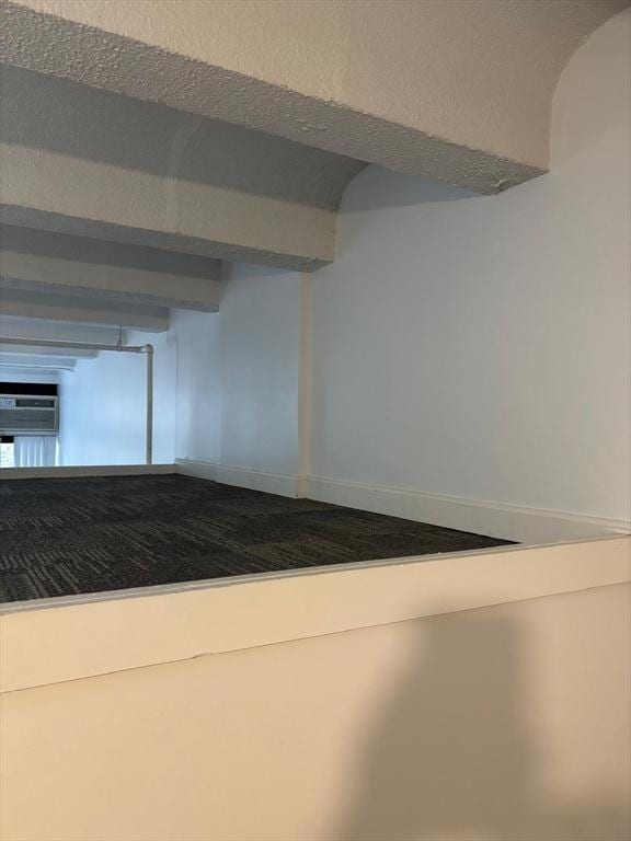 12 Stoneholm St Unit 313, Boston, MA 02115 - hallway featuring a wall unit AC and baseboards