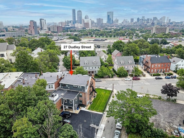 birds eye view of property with a city view