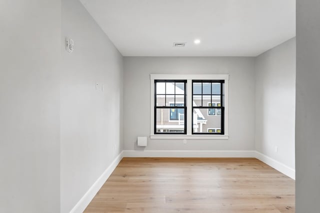 spare room featuring light hardwood / wood-style floors