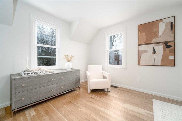 sitting room with light wood-style floors and baseboards