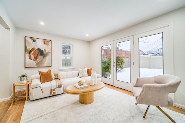 sitting room with wood finished floors, baseboards, and recessed lighting