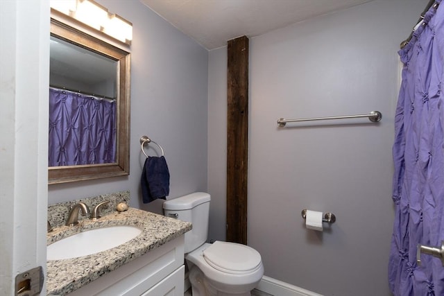 full bath featuring toilet and vanity