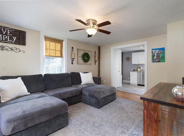 living room with light wood finished floors and ceiling fan