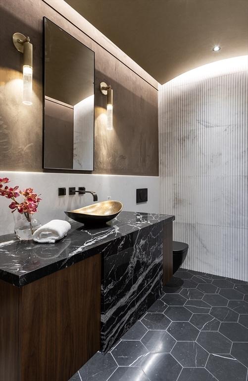 bathroom featuring tile patterned floors, toilet, and vanity