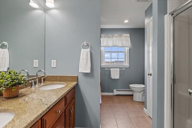 bathroom with tile patterned flooring, a stall shower, a sink, baseboards, and a baseboard heating unit