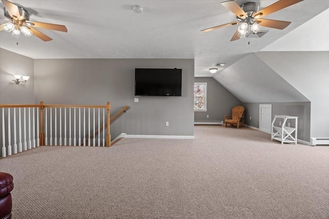 additional living space with baseboards, a ceiling fan, baseboard heating, and carpet flooring