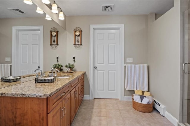 full bath with tile patterned floors, baseboard heating, a stall shower, and visible vents