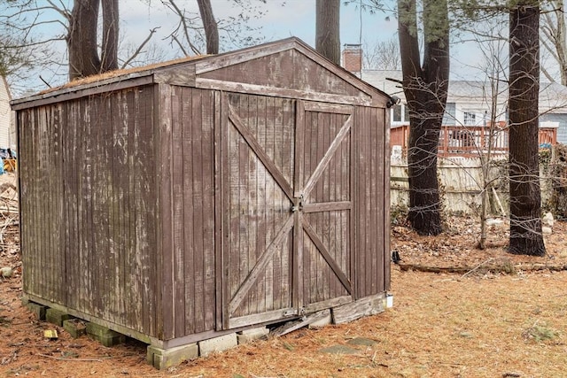 view of shed with fence