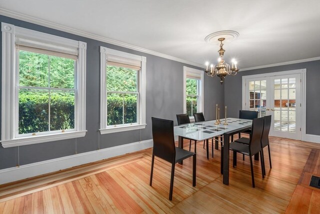 51 Summer St, Weston, MA 02493 - dining area featuring a chandelier, wood finished floors, baseboards, and crown molding